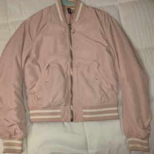 only wore once.light pink jacket. striped on end of the sleeves. two pockets